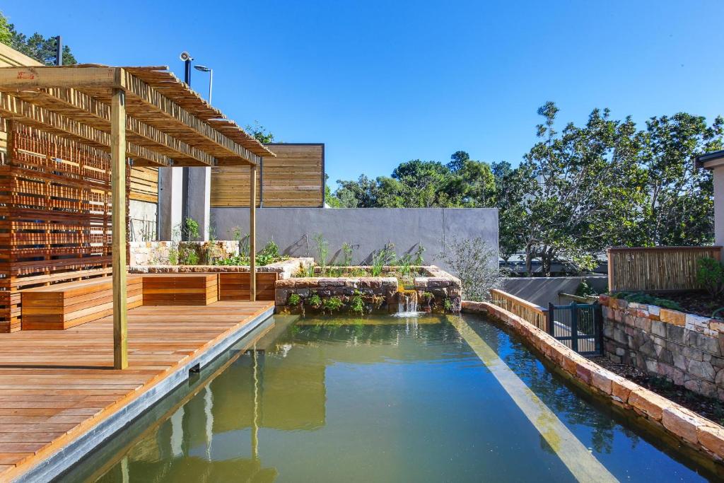 Solar-Powered Mountain Retreat with Natural Pool - main image